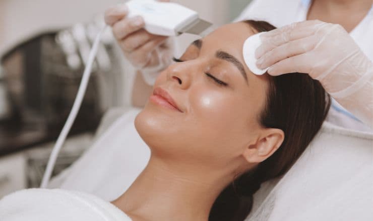 Girl taking the treatment of skin care